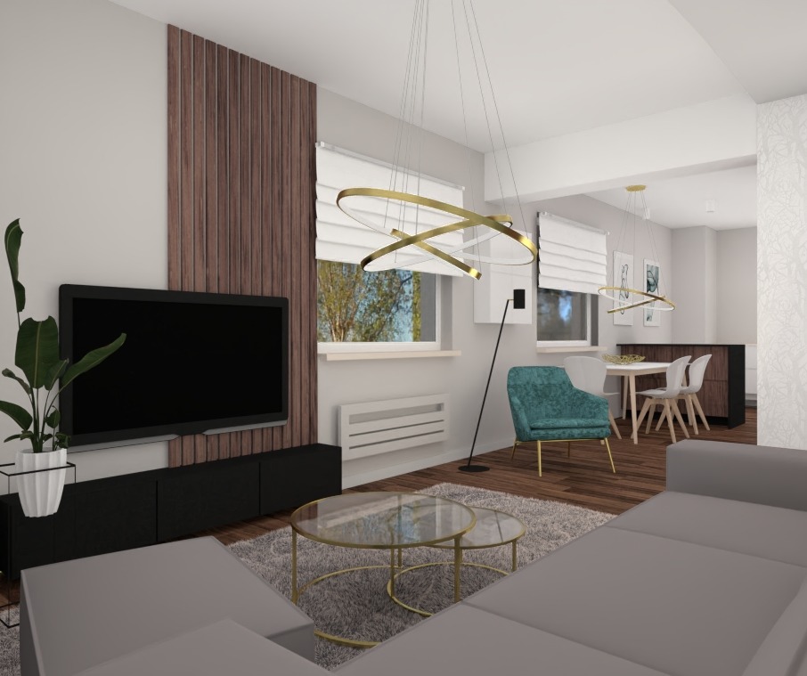 Wizualizacja nowoczesnego salonu z szarą sofą narożną, okrągłym szklanym stolikiem kawowym ze złotą ramą, turkusowym fotelem i lampami w kształcie złotych obręczy.