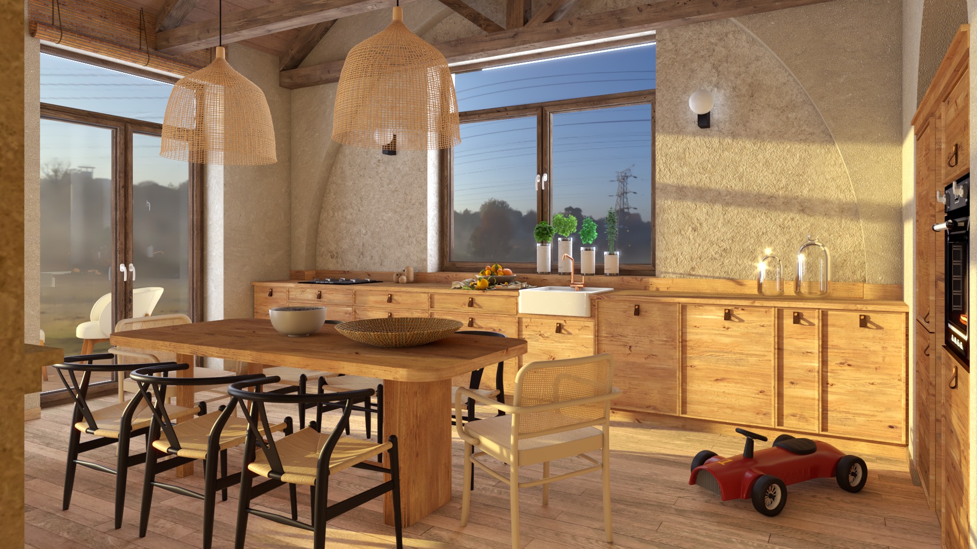 Jasne wnętrze kuchni z drewnianymi blatami, stołem i krzesłami z plecionki, oświetlone wiszącymi lampami z abażurami z naturalnego materiału. Widoczny fragment ściany z fakturą oraz czerwony...