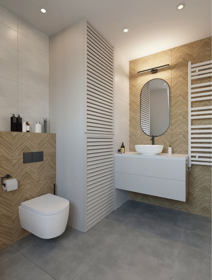 Nowoczesna łazienka z umywalką nablatową, owalnym lustrem podświetlonym listwą LED, białą toaletą podwieszaną i szafką z lamelami, wykończona płytkami w jodełkę.