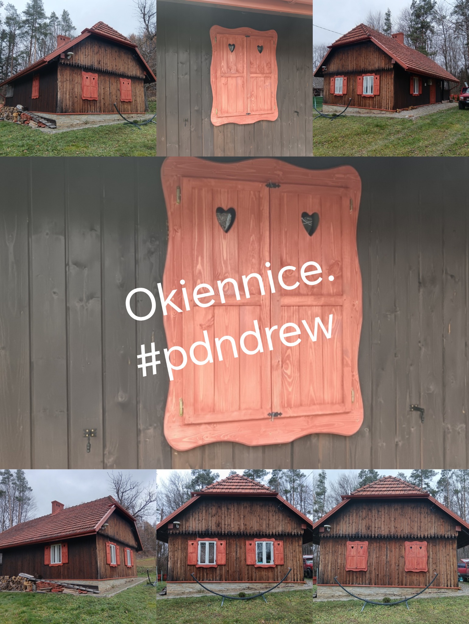 Dom z bali z drewnianymi, dekoracyjnymi okiennicami w kształcie serc, malowanymi na czerwono, otoczony zielenią.