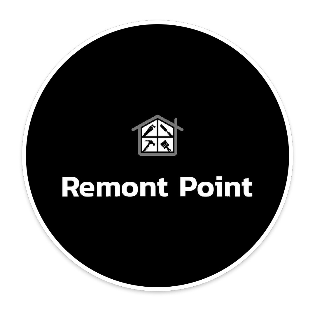Logo firmy Remont Point: czarne koło z białym obrysem, wewnątrz biały napis Remont Point i ikona domu, w której zamiast okien znajdują się narzędzia: piła, pędzel, młotek i śrubokręt.