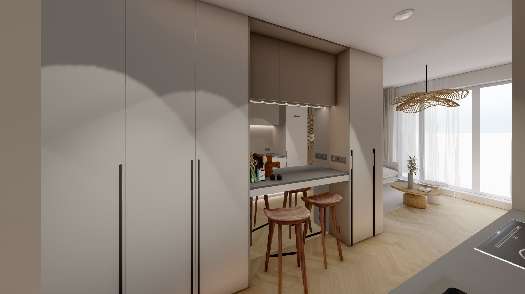 Projekt kawalerki: minimalistyczna kuchnia z barkiem i drewnianymi stołkami, jasne wnętrze z dużym oknem i designerską lampą. Widok na salon z elementami dekoracyjnymi.