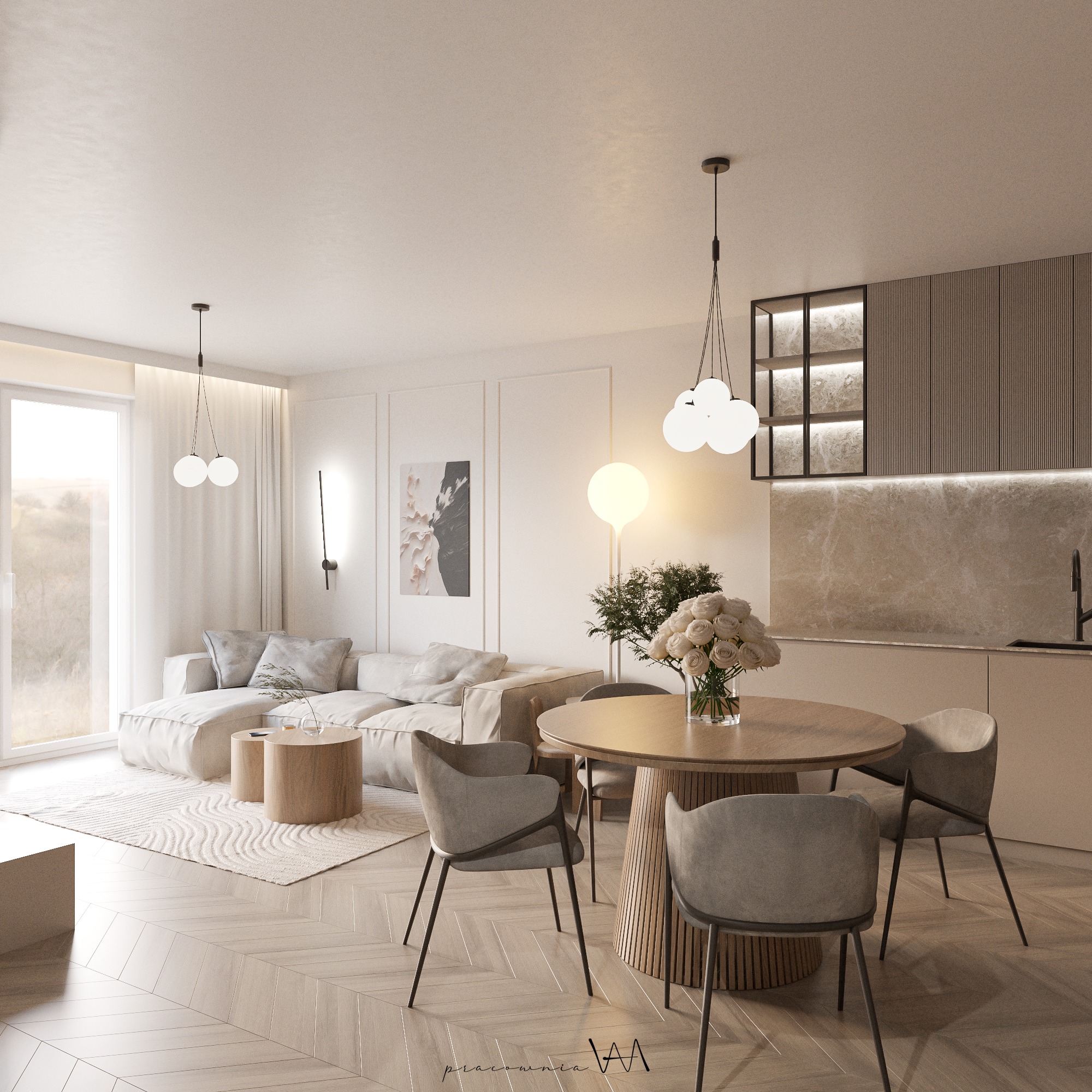 Jasne, przestronne wnętrze mieszkania z drewnianą podłogą w jodełkę, okrągłym stołem jadalnym z czterema krzesłami, narożną sofą i oświetleniem dekoracyjnym, w tle zabudowa kuchenna.