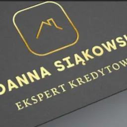 Wizytówka eksperta kredytowego Joanna Siąkowska z logo w kształcie domu, złote litery na ciemnoszarym tle.