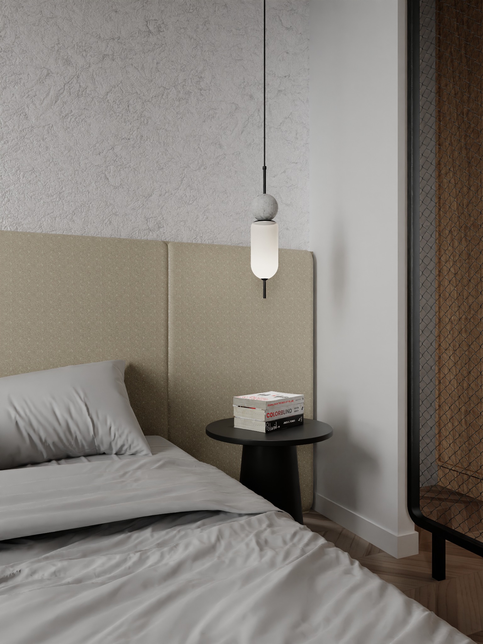 Nowoczesna sypialnia z szarym łóżkiem, beżowym zagłówkiem, lampką nocną z marmurowymi elementami i okrągłym stolikiem z książkami COLORBLIND.