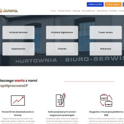 Kaminski.link - Strona internetowa hurtowni biurowej Jarkpol z artykułami biurowymi, chemią, tuszami, tonerami i dekoracjami na tle budynku firmy. Platforma B2B.