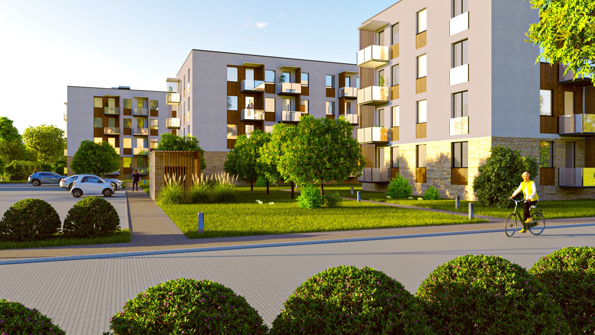 Wizualizacja osiedla nowoczesnych budynków wielorodzinnych z balkonami, zielonym terenem, parkingiem i osobą na rowerze w żółtej kamizelce.