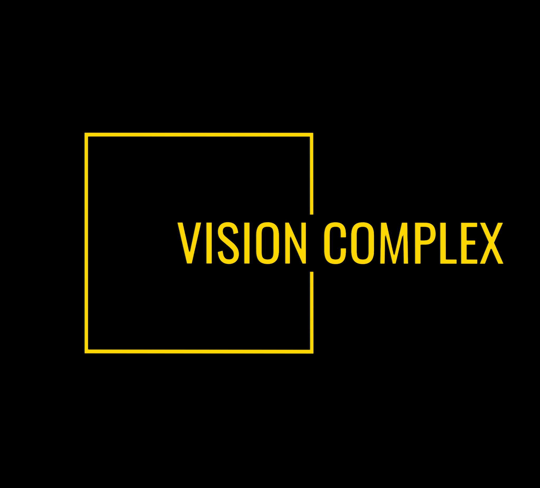 Żółty logotyp Vision Complex z prostokątną ramką na czarnym tle.