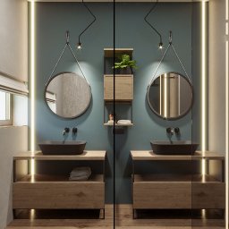 Inargo - Nowoczesna łazienka z dwoma umywalkami w kształcie misy na drewnianych szafkach, okrągłe lustra zawieszone na łańcuszkach, podświetlenie LED wzdłuż ścian, minimalistyczne baterie, półka z rośliną...