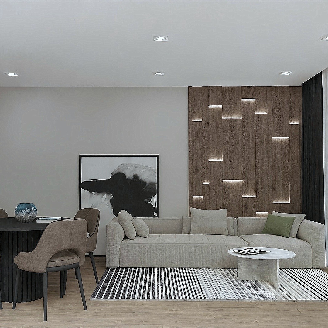 Nowoczesne wnętrze: beżowa sofa z poduszkami na czarno-białym dywanie, okrągły stolik kawowy z marmurowym blatem, okrągły stół jadalny z krzesłami, abstrakcyjny obraz w czarnej ramie...