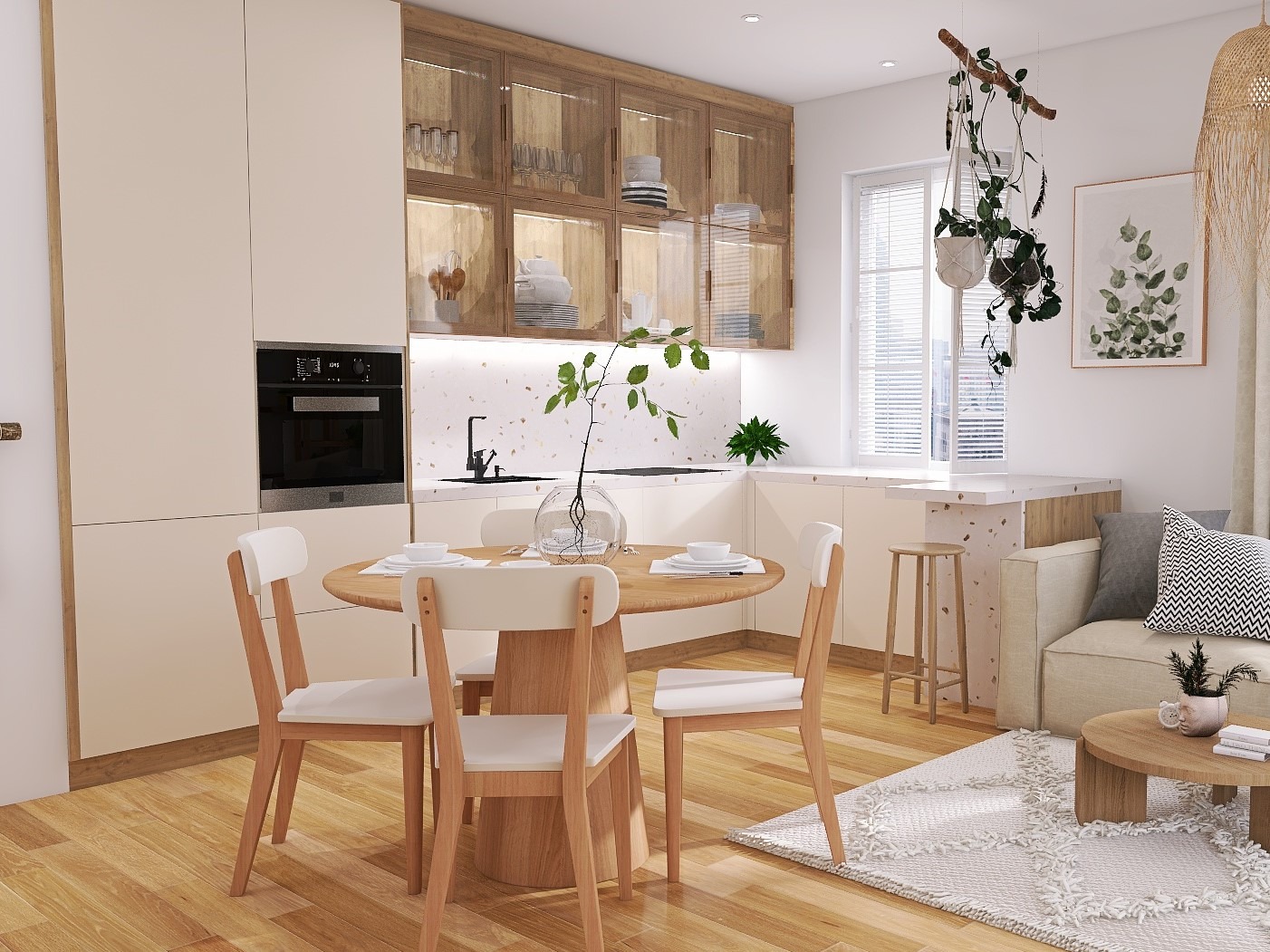 Jasna kuchnia z drewnianymi akcentami, okrągły stół z czterema krzesłami, zabudowa kuchenna z przeszklonymi szafkami górnymi i wbudowanym piekarnikiem, dekoracje roślinne w tle.