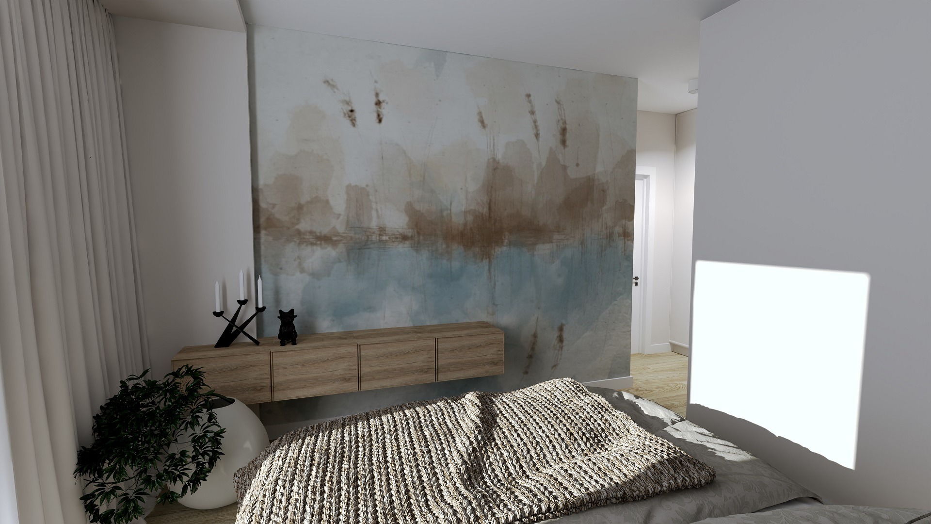 Sypialnia z drewnianą szafką RTV podwieszoną na ścianie z abstrakcyjnym malowidłem, czarny świecznik i figurka kota na szafce, pleciona narzuta na łóżku i roślina doniczkowa w białej osłonce.