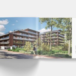 BR Studio Graficzne Barbara Rutkowska - Rozkładówka katalogu reklamowego prezentująca wizualizację dwóch nowoczesnych budynków apartamentowych z cegły z przeszklonymi balkonami, otoczonych zielenią i z widocznymi przechodniami...