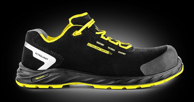 Czarno-żółty but roboczy marki VM Safety, model Ultralight Safety S3, z elementami odblaskowymi i wzmocnionym noskiem, na czarnym tle.