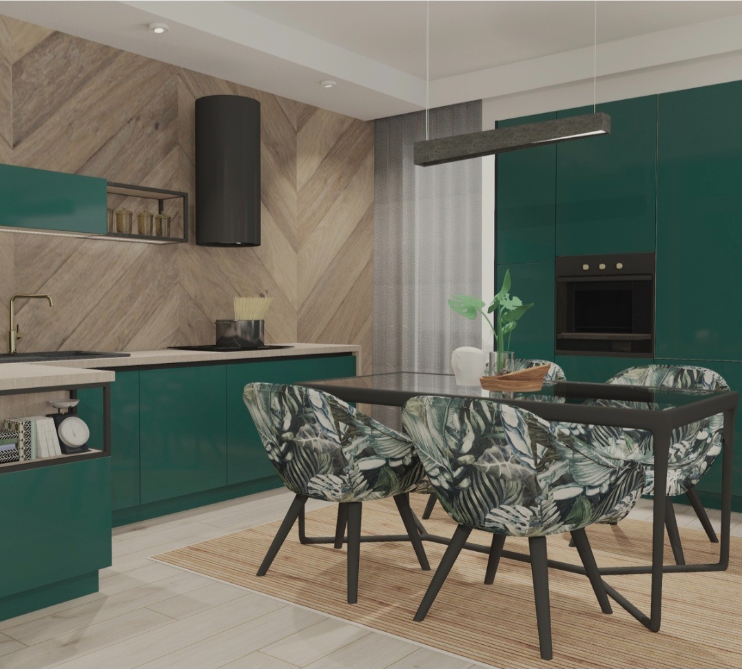 Nowoczesna kuchnia z zielonymi szafkami, drewnianą ścianą w jodełkę, stołem z czarną ramą i krzesłami w tropikalne liście, oświetlona podłużną lampą.