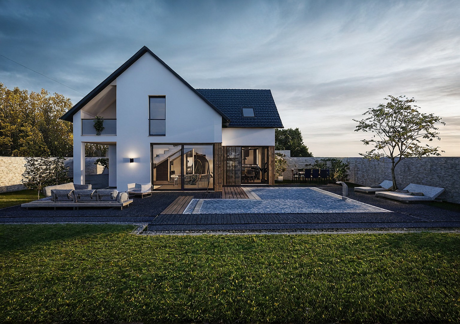 Nowoczesny dom z basenem oświetlony wieczornym światłem. Minimalistyczna architektura, biała elewacja, duże przeszklenia, taras z meblami ogrodowymi i starannie zaprojektowany ogród.