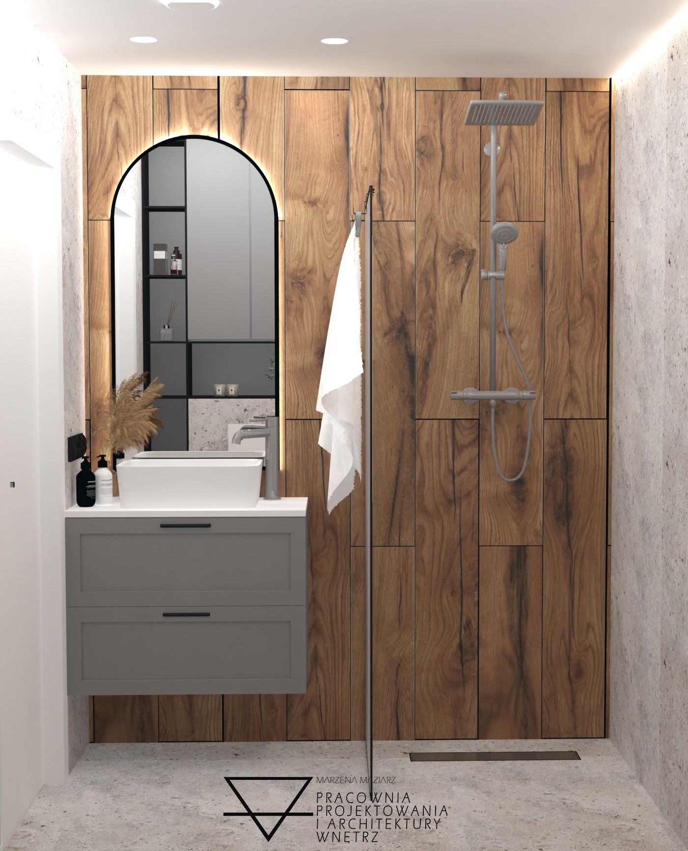 Nowoczesna łazienka z drewnianą okładziną, umywalką nablatową na szarej szafce i lustrem w czarnej ramie, minimalistyczny design z akcentami naturalnego drewna.