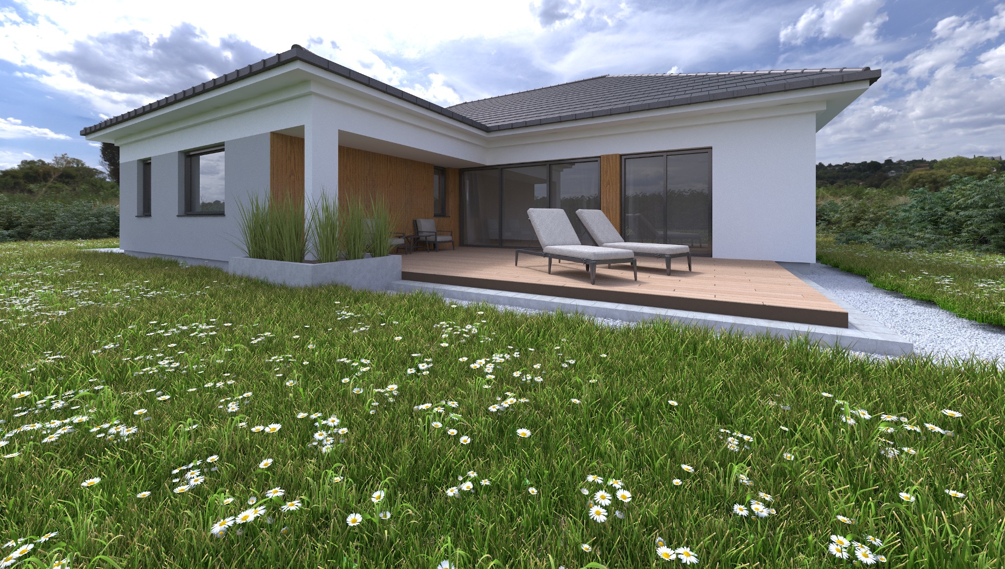 Parterowy dom z drewnianym tarasem i leżakami. Widok na ogród z kwitnącymi stokrotkami. Biała elewacja i szara dachówka. Nowoczesny projekt domu.