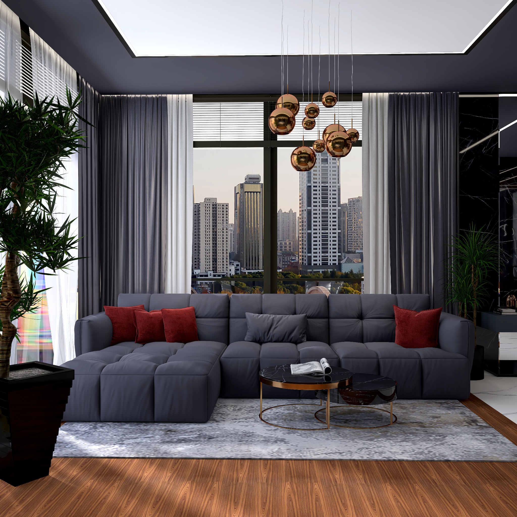 Nowoczesny salon z szarą sofą modułową, czerwonymi poduszkami i stolikami kawowymi na tle panoramy miasta widzianej przez okno.