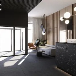 Nowoczesne wnętrze biura w Raniżowie z recepcją z czarnego lastryko, minimalistycznym oświetleniem i strefą oczekiwania z szarą sofą i roślinami.