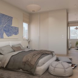 Revelo Wioletta Pietras - Jasna sypialnia w neutralnych barwach z dużym łóżkiem, abstrakcyjnym obrazem na ścianie i widokiem na miasto w oddali. Nowoczesne wnętrze mieszkania na sprzedaż.