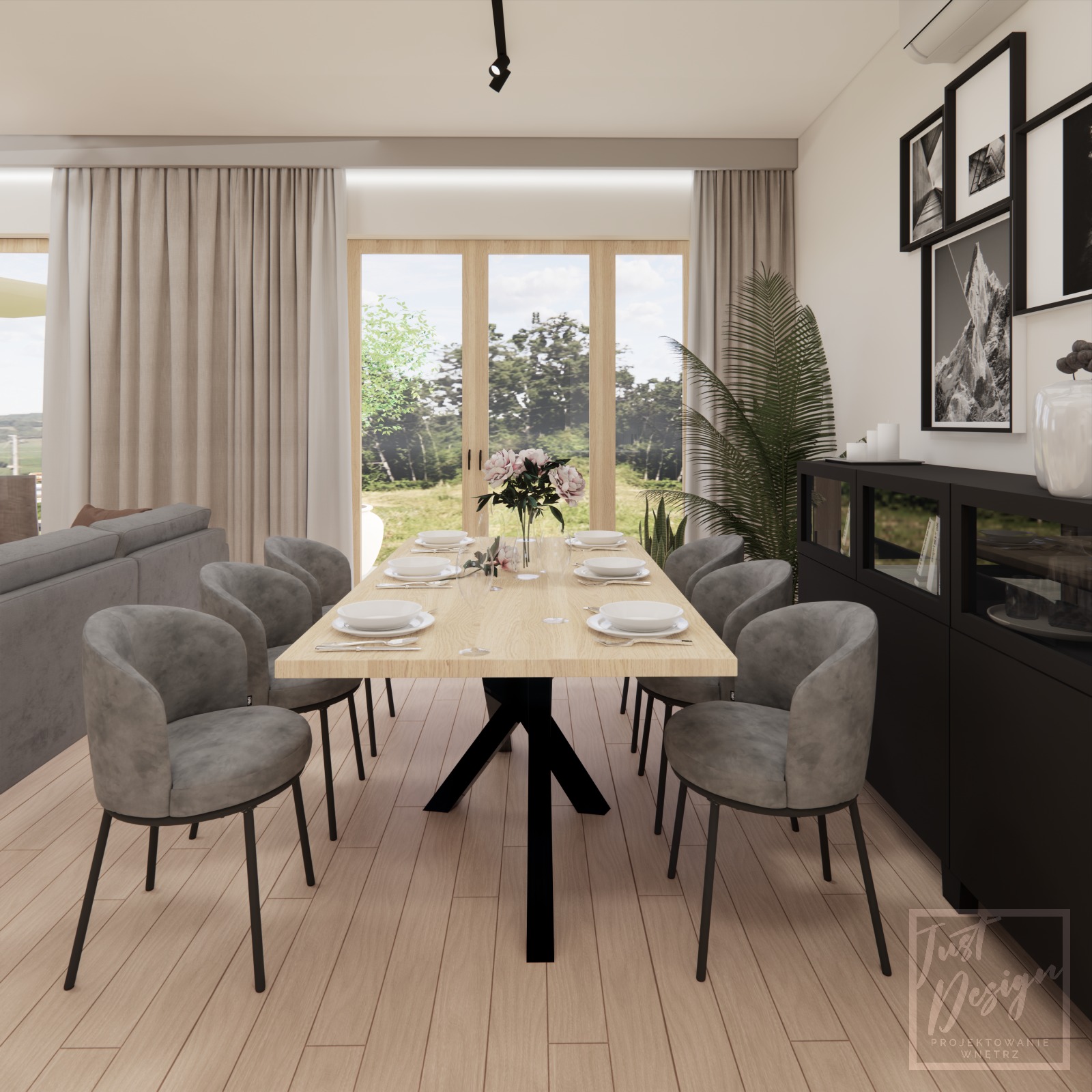 Jasna jadalnia z drewnianym stołem na czarnej podstawie, otoczonym szarymi krzesłami, z widokiem na ogród przez duże okna i czarną szafką z dekoracjami, uzupełniona sztuką na ścianie i rośliną...