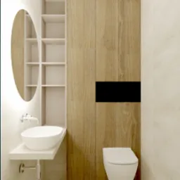 Minimalistyczna łazienka z okrągłym lustrem z podświetleniem LED, wiszącą umywalką na blacie, szafką z drewnopodobnymi frontami i wiszącą miską WC.