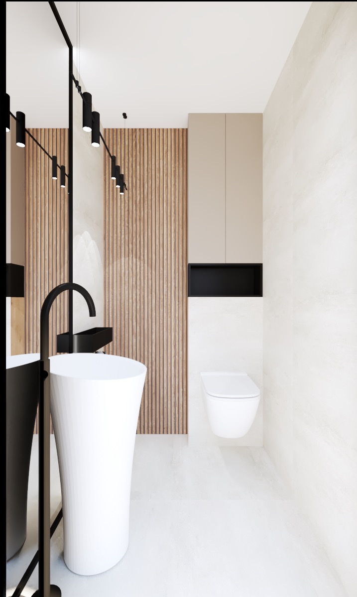 Nowoczesna łazienka z białą umywalką wolnostojącą, czarną armaturą, drewnianą ścianą z pionowych paneli i podwieszaną toaletą.