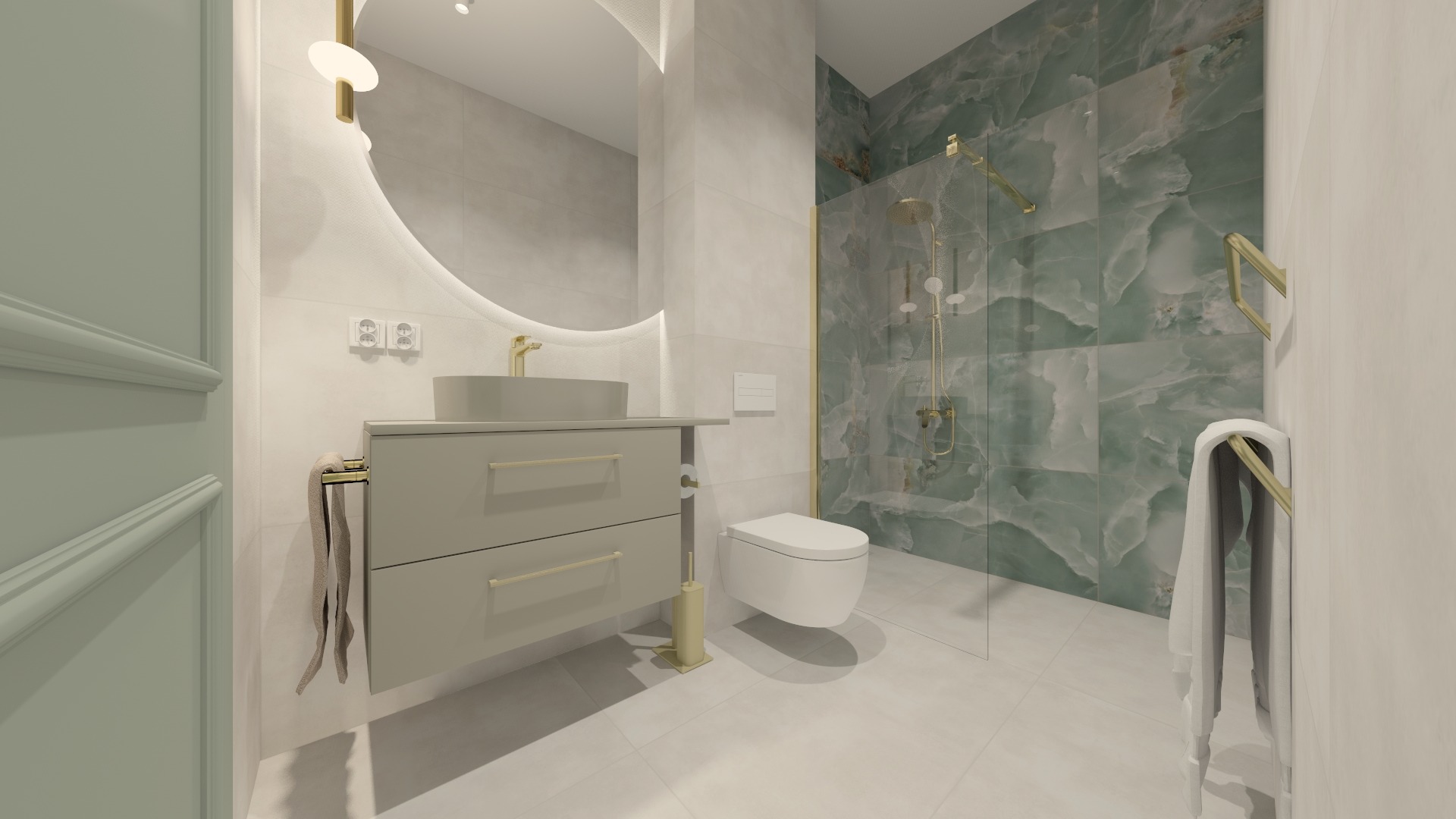 Nowoczesna łazienka z umywalką nablatową, okrągłym lustrem podświetlanym LED, kabiną prysznicową z zielonymi płytkami imitującymi marmur i złotymi detalami.