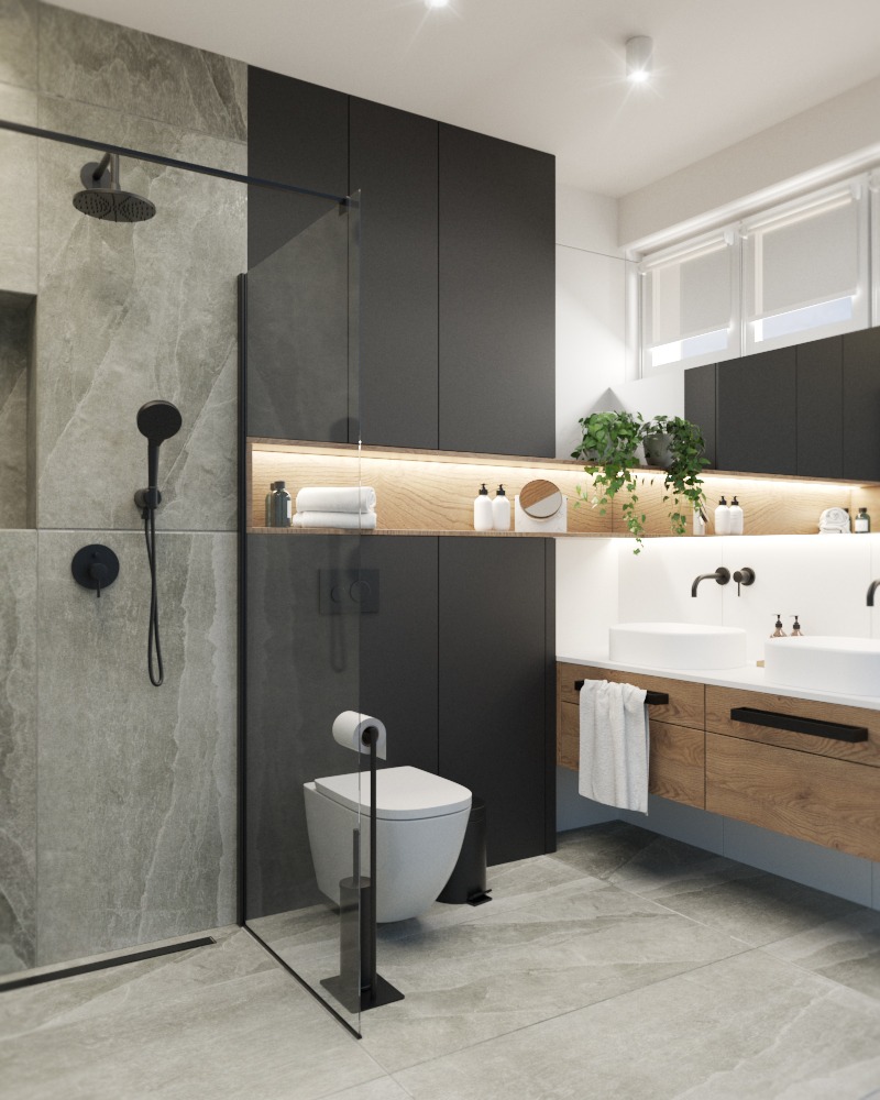 Nowoczesna łazienka z kabiną prysznicową typu walk-in, umywalkami nablatowymi i czarnymi szafkami, oświetlona listwą LED pod półką z dekoracjami.