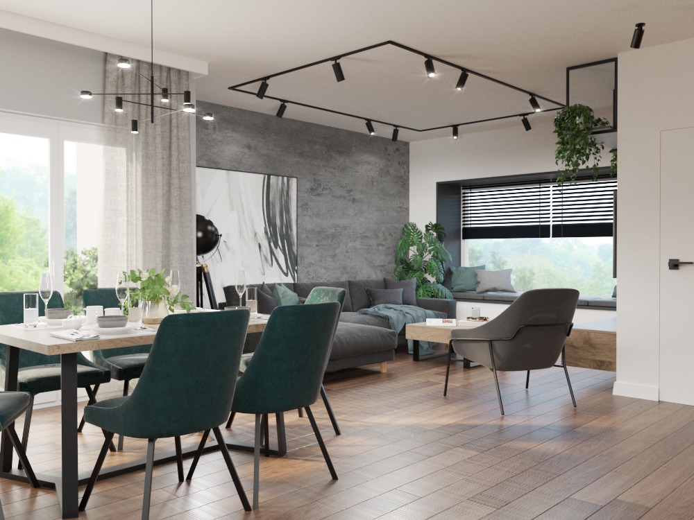 Nowoczesne wnętrze jadalni z drewnianą podłogą, stołem z ciemnozielonymi krzesłami, betonową ścianą i oświetleniem szynowym.