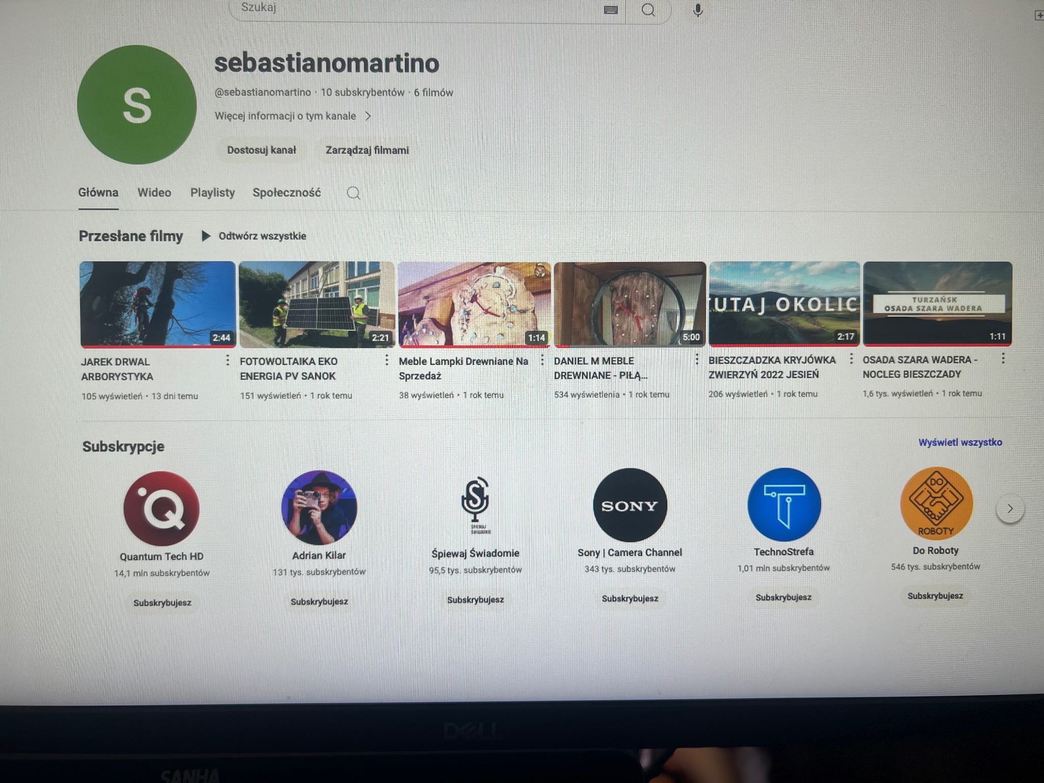 Zrzut ekranu strony profilu użytkownika sebastianomartino na YouTube, prezentujący miniaturki przesłanych filmów o tematyce arboryzacji, fotowoltaiki, mebli drewnianych i krajobrazów Bieszczadzkich.