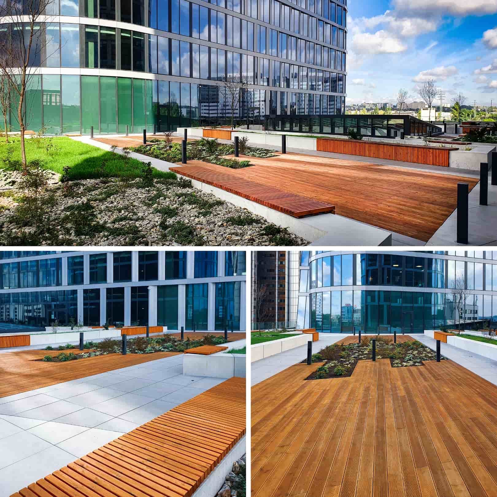 Drewniany taras z ławkami w Global Office Park w Katowicach, otoczony nowoczesną architekturą biurową i zielenią.