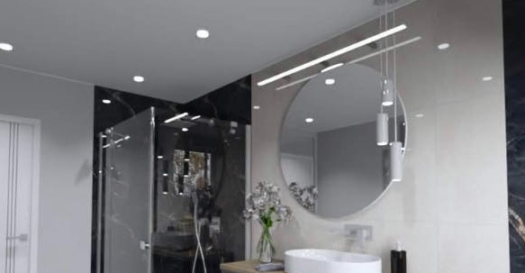 Nowoczesna łazienka z okrągłym lustrem, wiszącymi lampami i kabiną prysznicową z czarnymi akcentami.