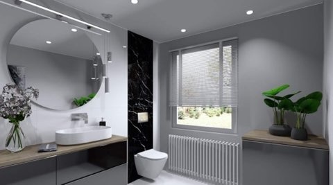 Nowoczesna łazienka z okrągłym lustrem, umywalką nablatową, czarnym panelem imitującym marmur przy toalecie i grzejnikiem pod oknem.