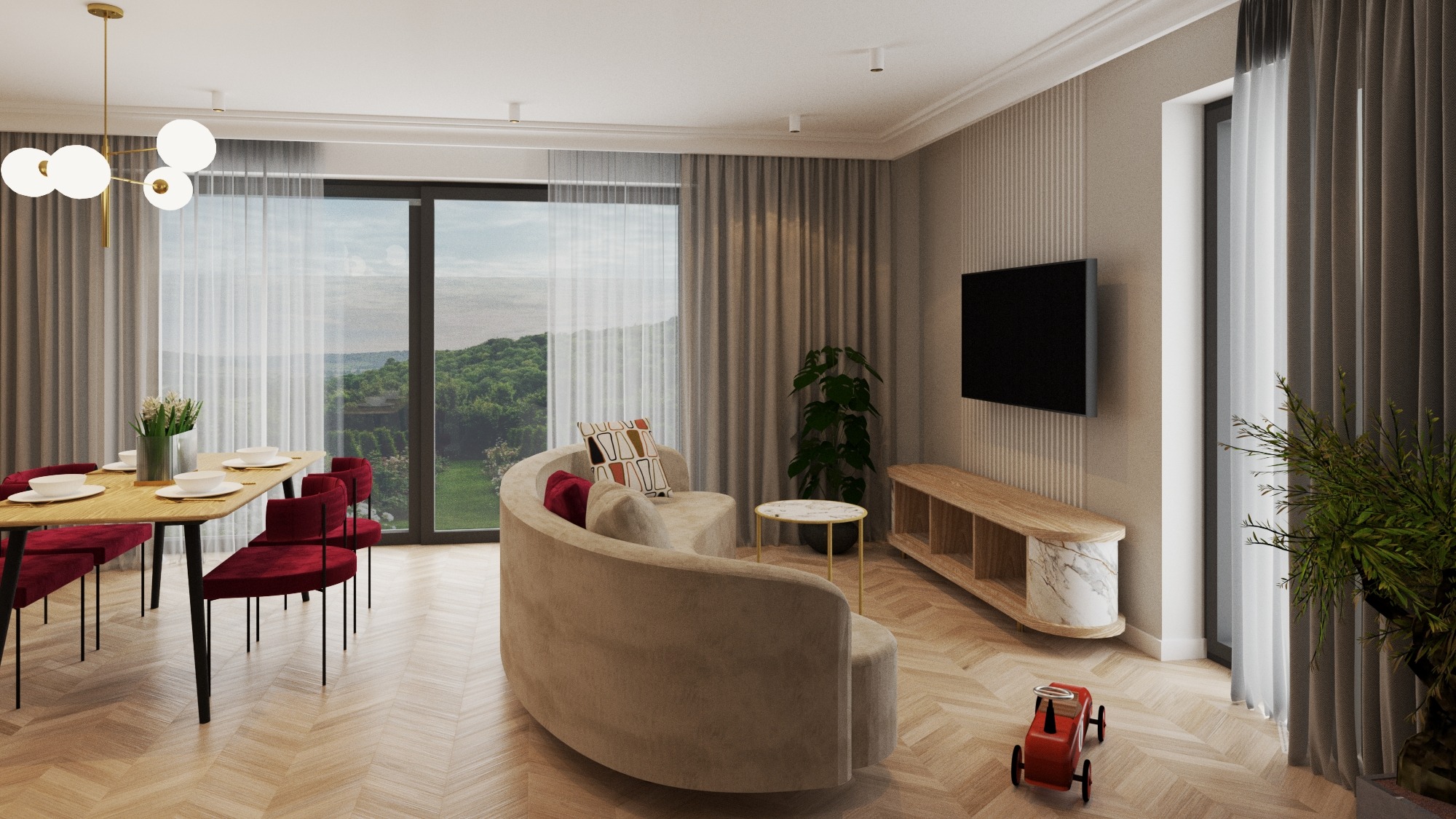 Jasne wnętrze z parkietem w jodełkę, zaokrąglona sofa z poduszkami, drewniany stół z czerwonymi krzesłami, telewizor na ścianie i widok na zieleń za oknem.