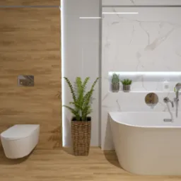 Nowoczesna łazienka z drewnianymi i marmurowymi elementami, wolnostojąca wanna, wisząca toaleta, oświetlona półka z kosmetykami i doniczką z rośliną.