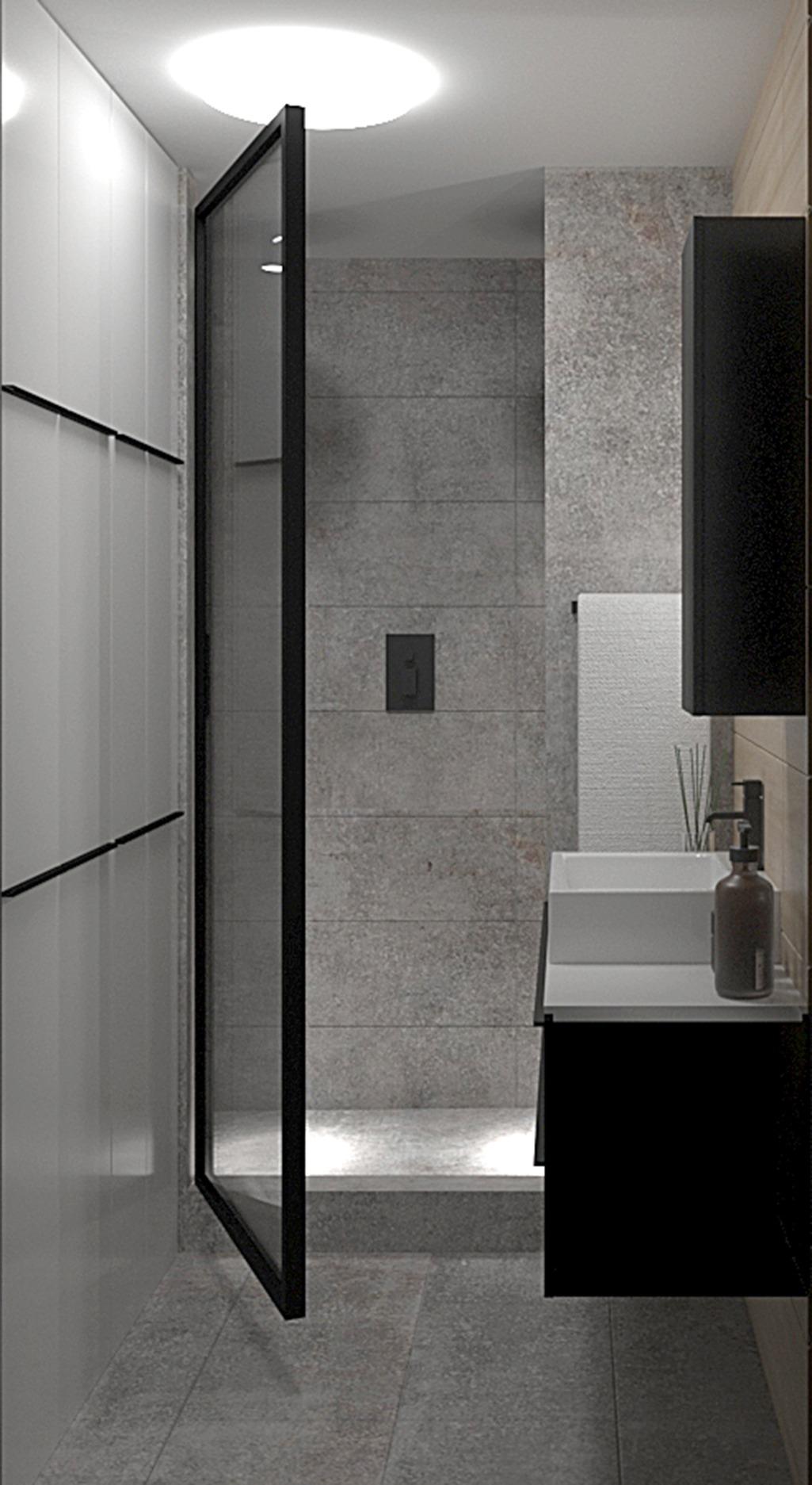 Nowoczesna łazienka z kabiną prysznicową z czarną ramą, szarą płytką imitującą kamień, białą umywalką nablatową i czarną szafką pod umywalką, minimalistyczny design.