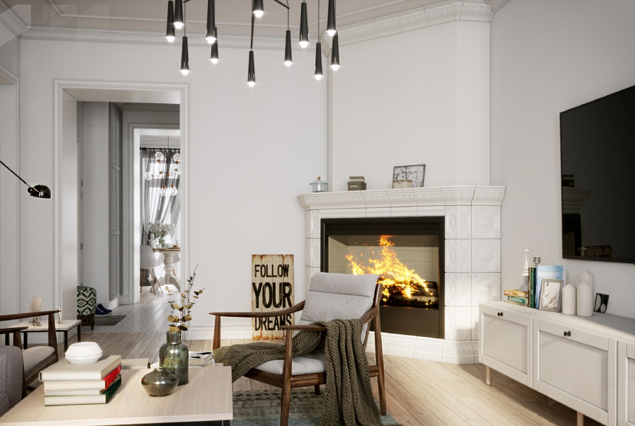 Jasne wnętrze salonu z kominkiem obudowanym białymi kaflami, drewnianym fotelem z pledem i plakatem 'Follow your dreams', widok na jadalnię w głębi.