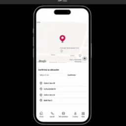 Ekran smartfona prezentujący interfejs aplikacji z mapą i lokalizacją w tle, prawdopodobnie w Gdańsku lub innym mieście, z zaznaczoną lokalizacją i listą adresów do wyboru, służący do potwierdzenia...