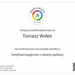 Certyfikat Google Ads z reklamy aplikacji dla Tomasza Wołka, ważny do 14 lutego 2024, z unikalnym identyfikatorem 142348818.
