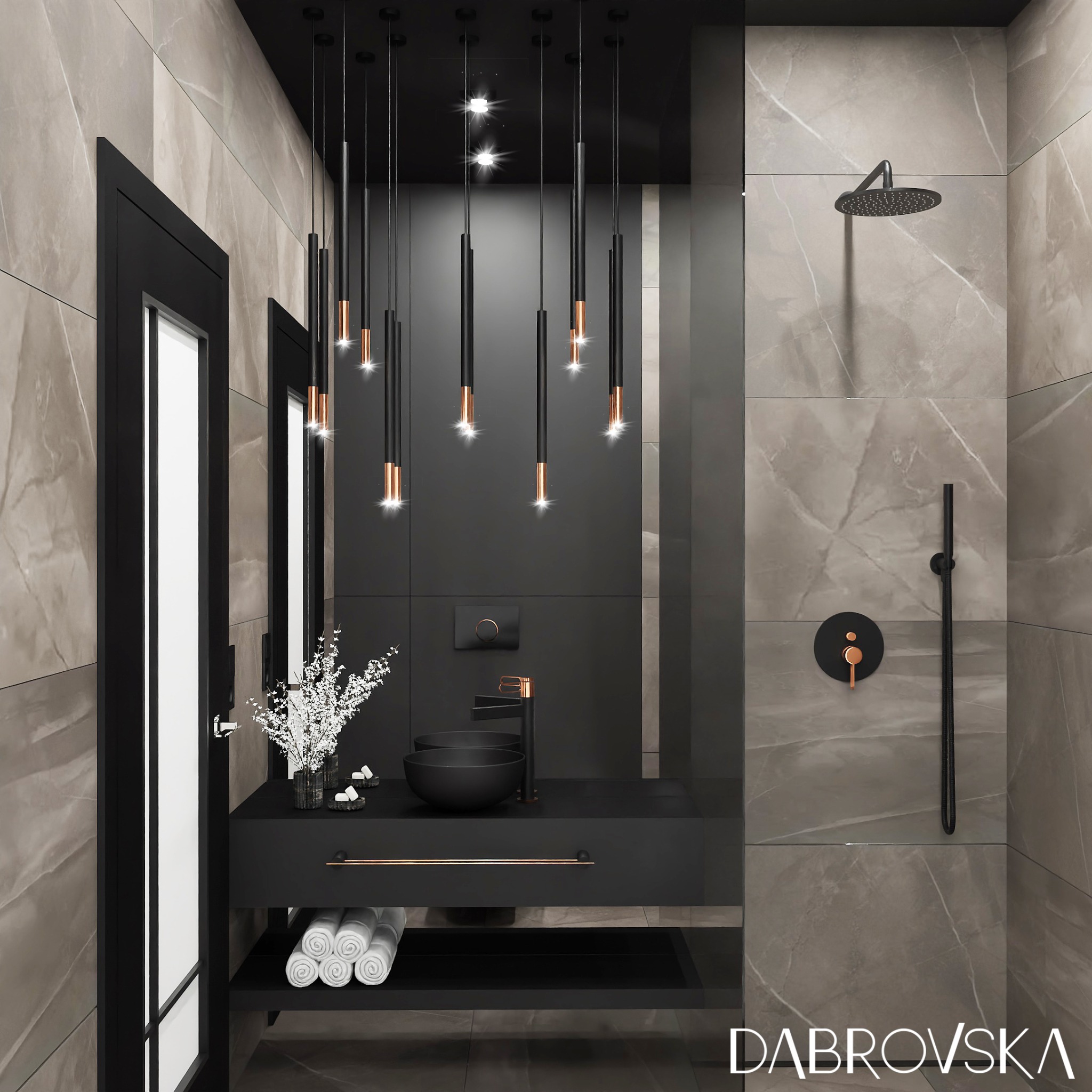 Nowoczesna łazienka z czarną armaturą, wiszącymi lampami z miedzianymi akcentami, umywalką nablatową i marmurowymi płytkami.