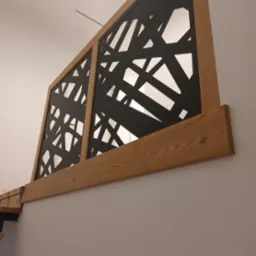 Drewniana balustrada schodowa z czarnym, ażurowym wypełnieniem o nieregularnym wzorze, zamontowana na białej ścianie, widoczny fragment schodów.