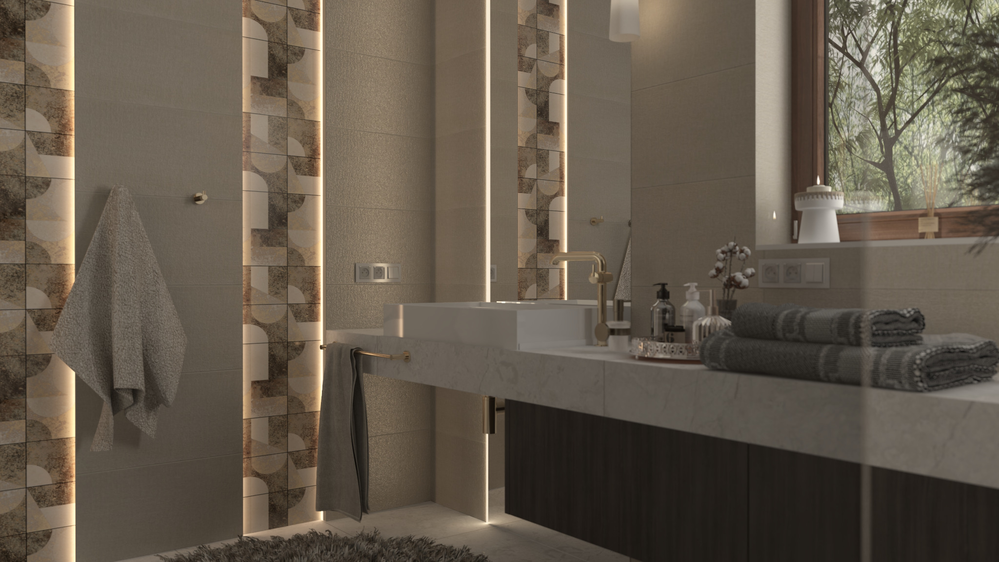 Nowoczesna łazienka z podświetlanymi panelami dekoracyjnymi, jasnymi płytkami, białym blatem umywalki i złotą armaturą, ręcznikami oraz widokiem na zieleń za oknem.