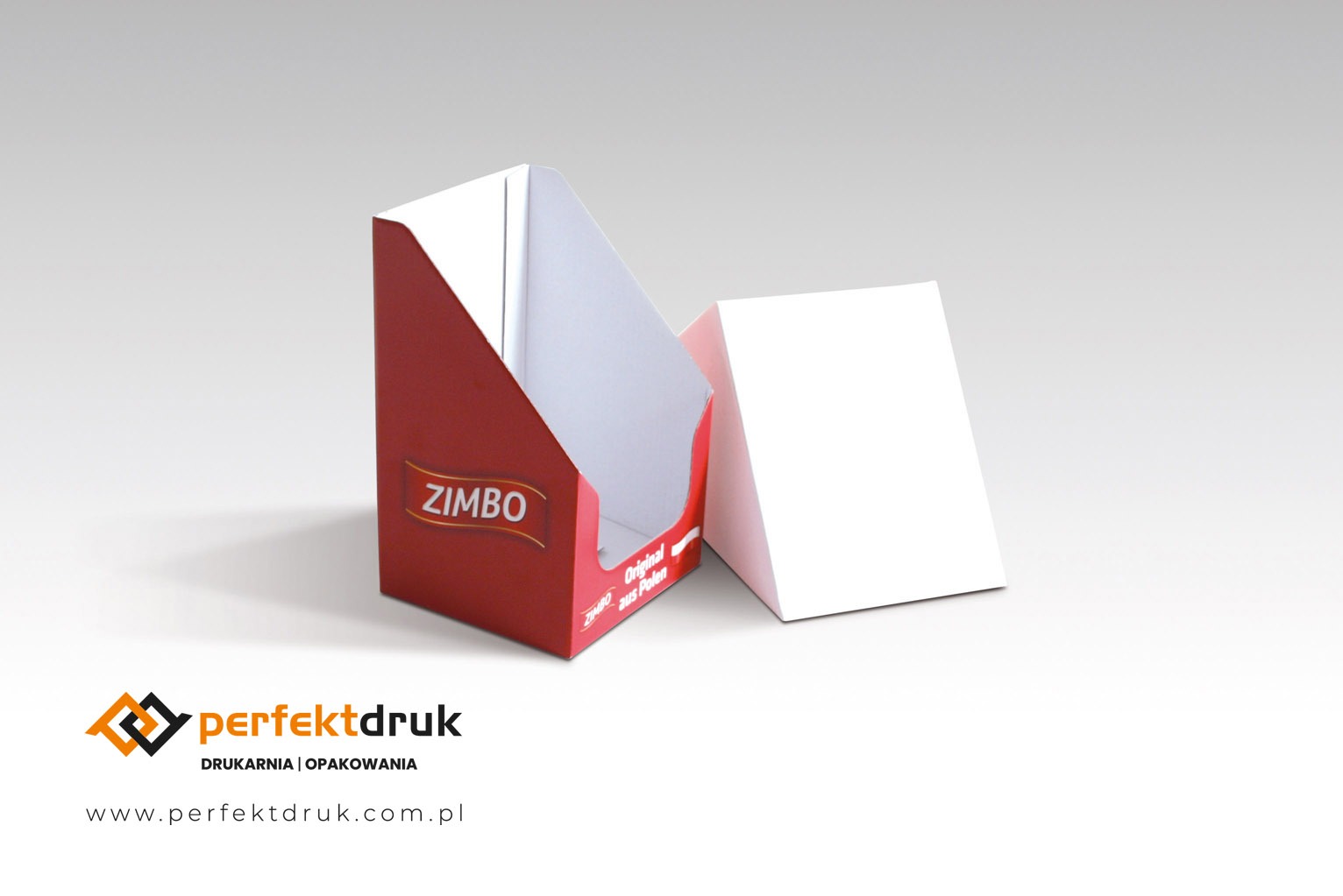 Czerwony, kartonowy display reklamowy marki Zimbo, z widocznym logo drukarni Perfectdruk, ustawiony na białym tle.