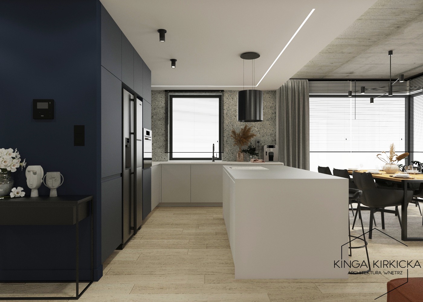 Nowoczesna kuchnia z wyspą w odcieniach bieli, szarości i granatu, z widoczną strefą jadalną i minimalistycznym oświetleniem sufitowym.