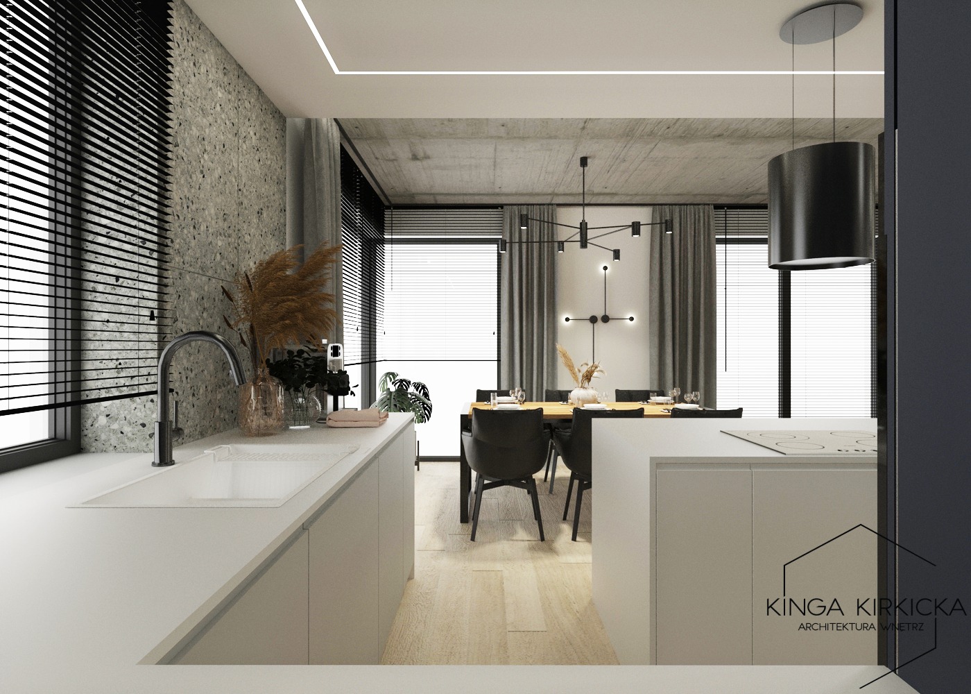 Nowoczesna kuchnia z wyspą w minimalistycznym stylu, z blatem z konglomeratu, widok na jadalnię z drewnianym stołem i designerską lampą, okna z żaluzjami.