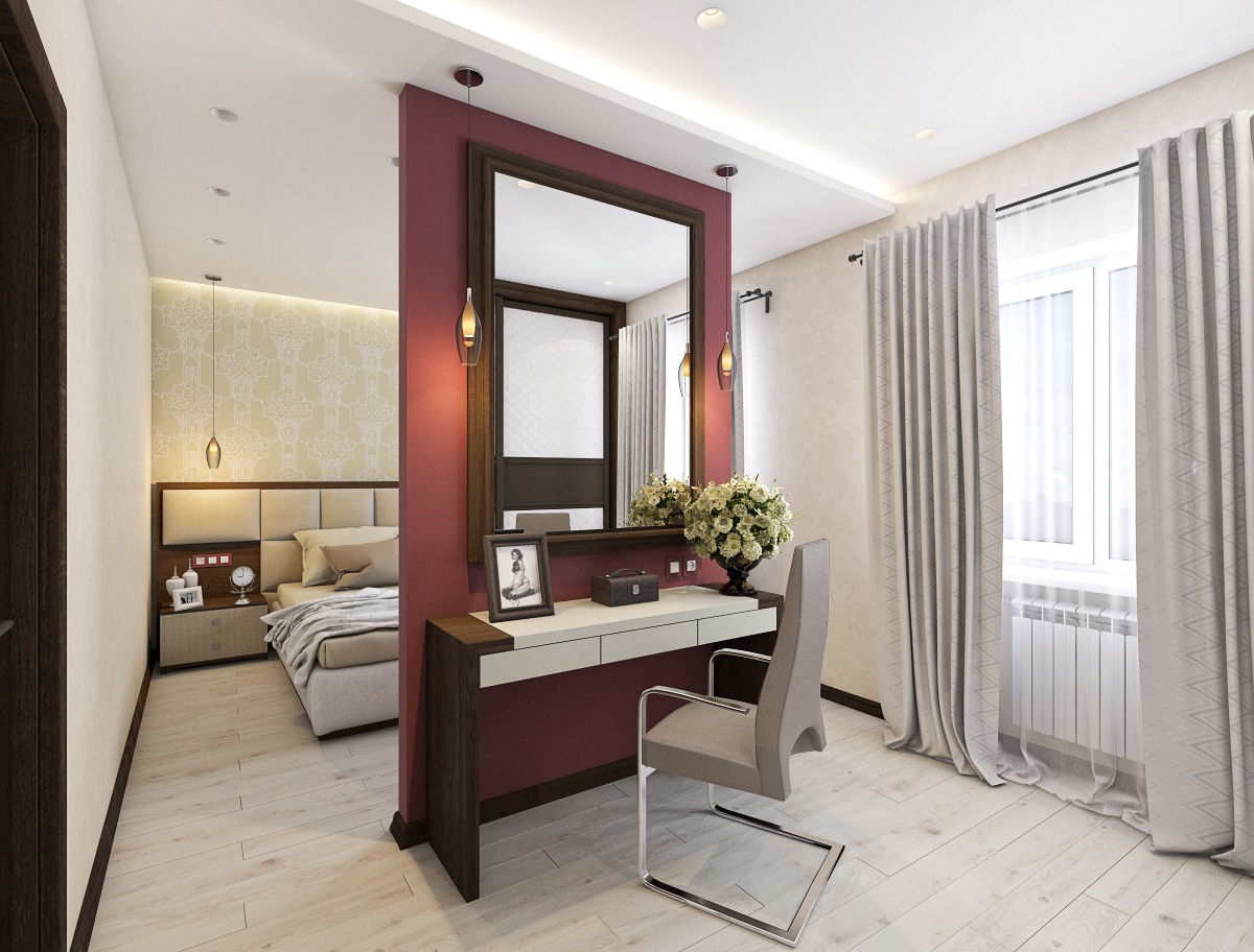 Nowoczesna sypialnia z toaletką w odcieniach beżu i bordo, drewniana podłoga, lustro w ciemnej ramie, widok na łóżko z szafką nocną i wzorzystą tapetą w tle.