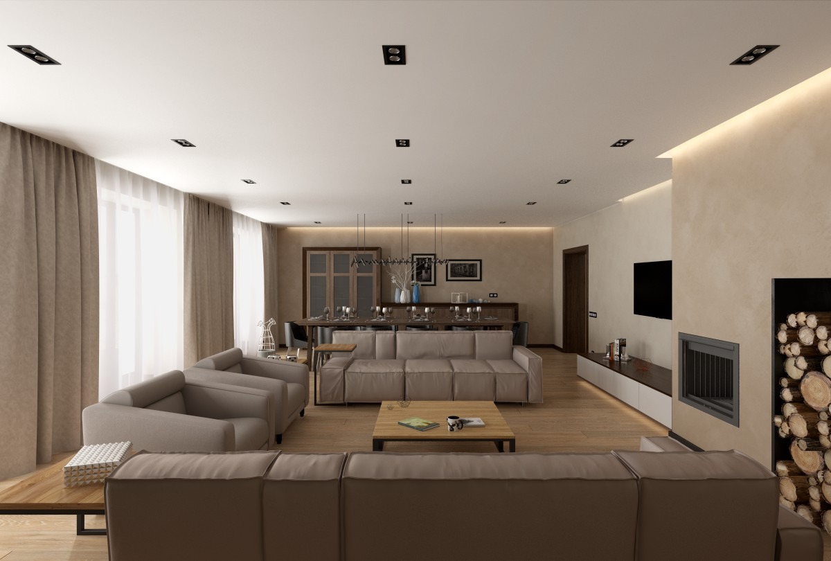 Jasne, przestronne wnętrze salonu z jadalnią, neutralna kolorystyka, drewniana podłoga, minimalistyczny kominek z zapasem drewna, nowoczesne oświetlenie sufitowe, sofa modułowa i krzesła w tle.