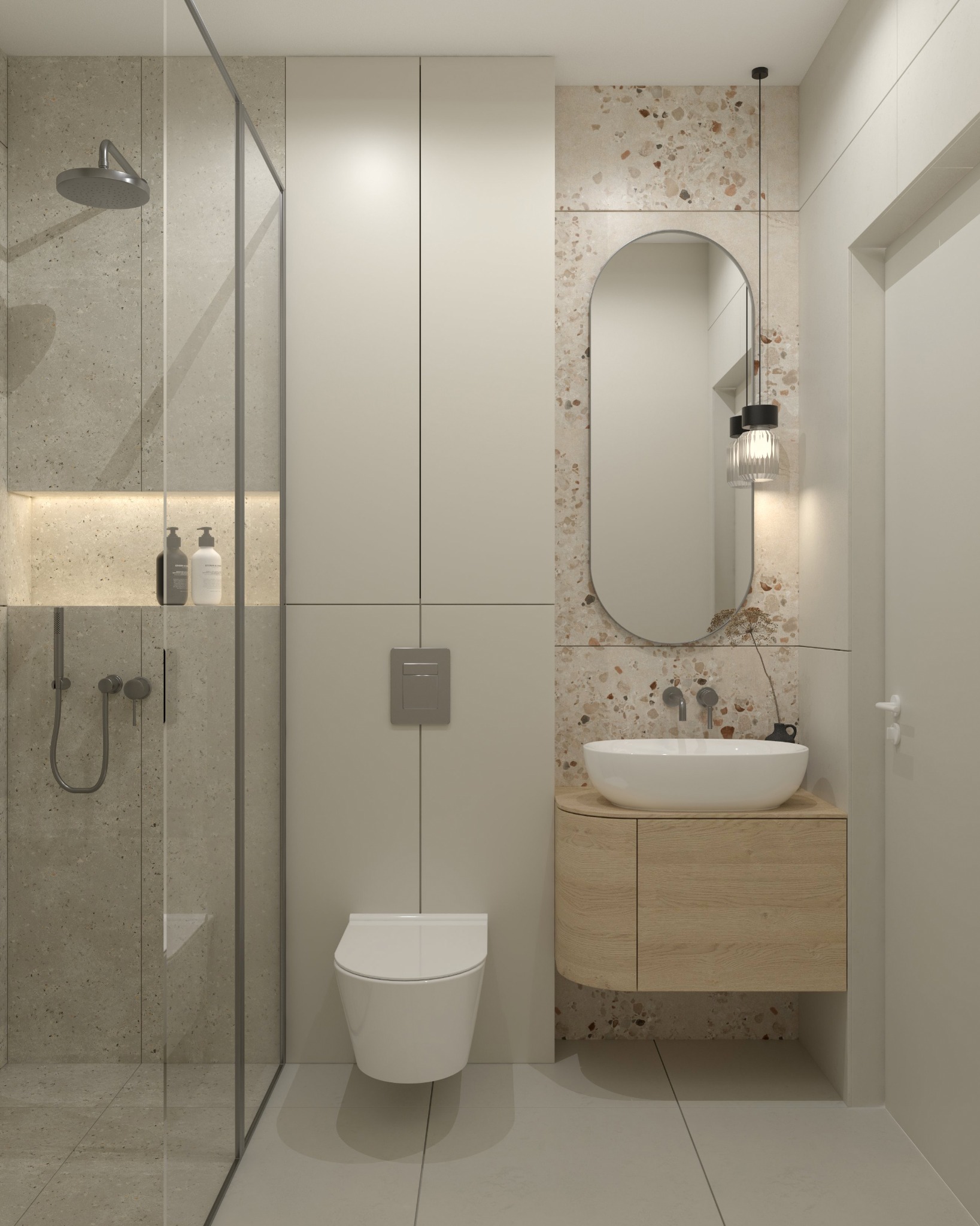 Nowoczesna łazienka z kabiną prysznicową typu walk-in, umywalką nablatową na drewnianej szafce i lustrem w owalnej ramie na tle ściany z terazzo.